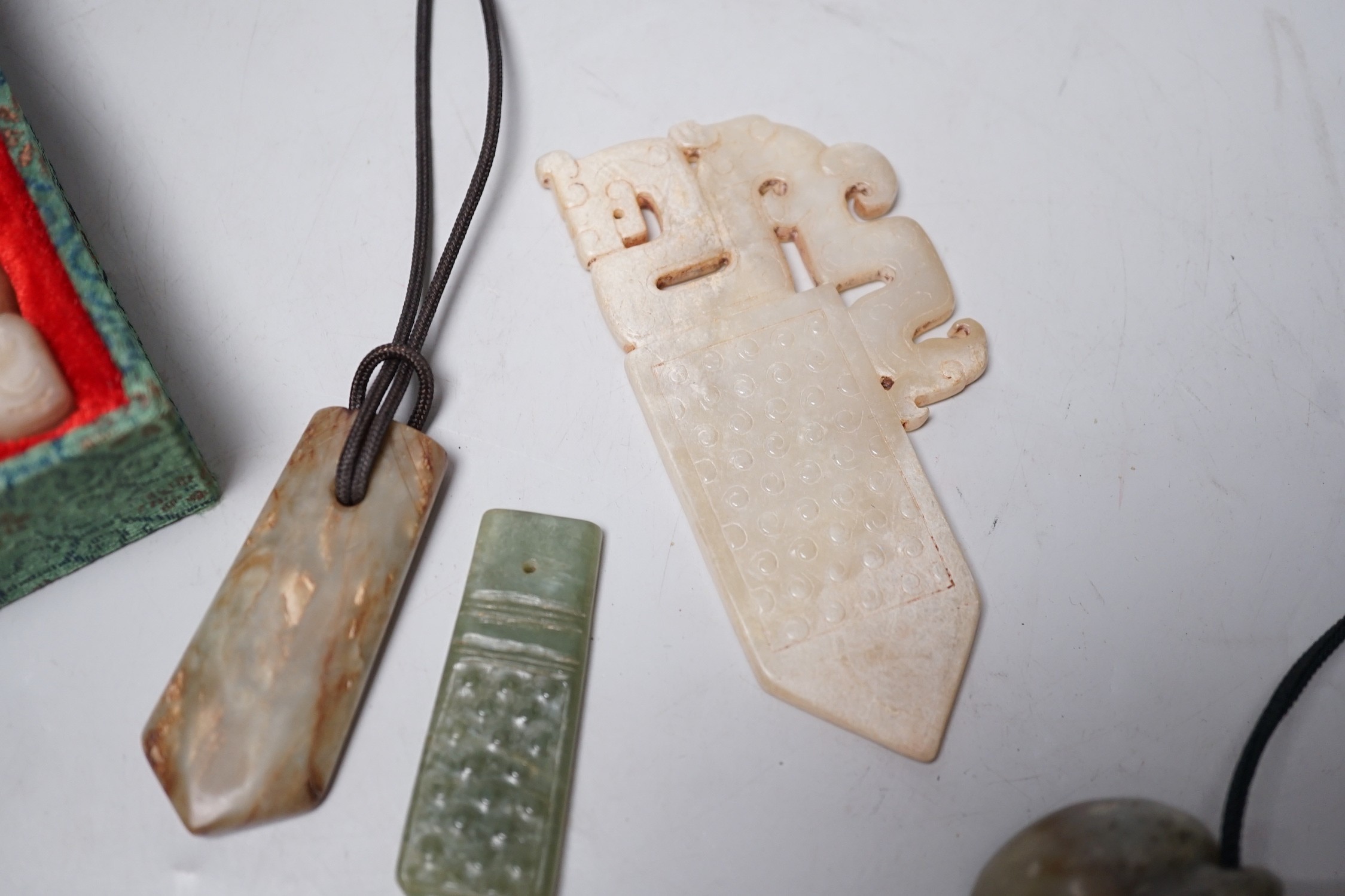 A group of various Chinese jade carvings and a white glass plaque